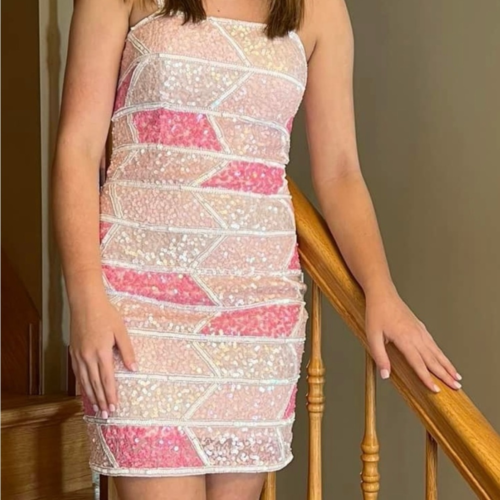 Size 00 homecoming dress.  Extra beads and sequins if needed.